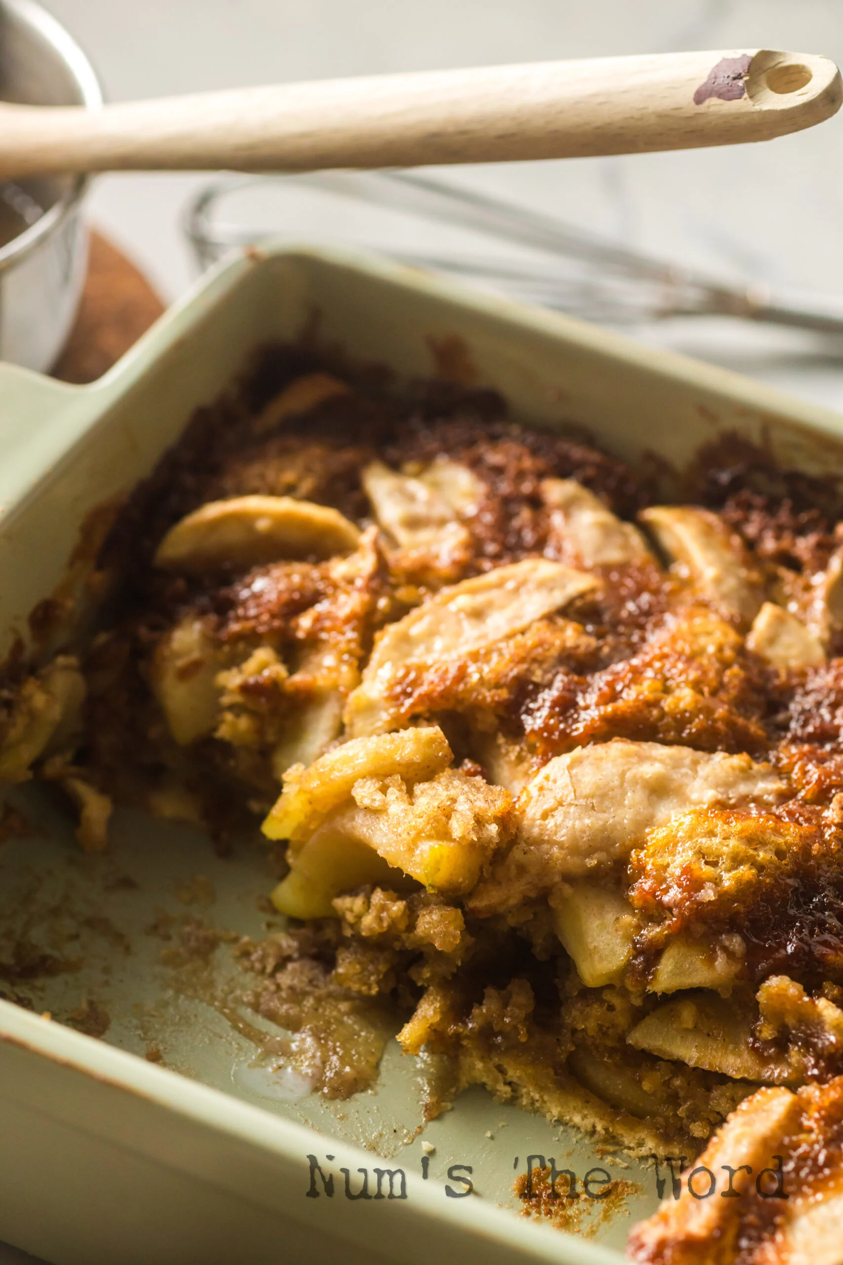 A portion of cake scooped out of pan