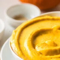 zoomed in image of pumpkin dip in bowl ready to serve.