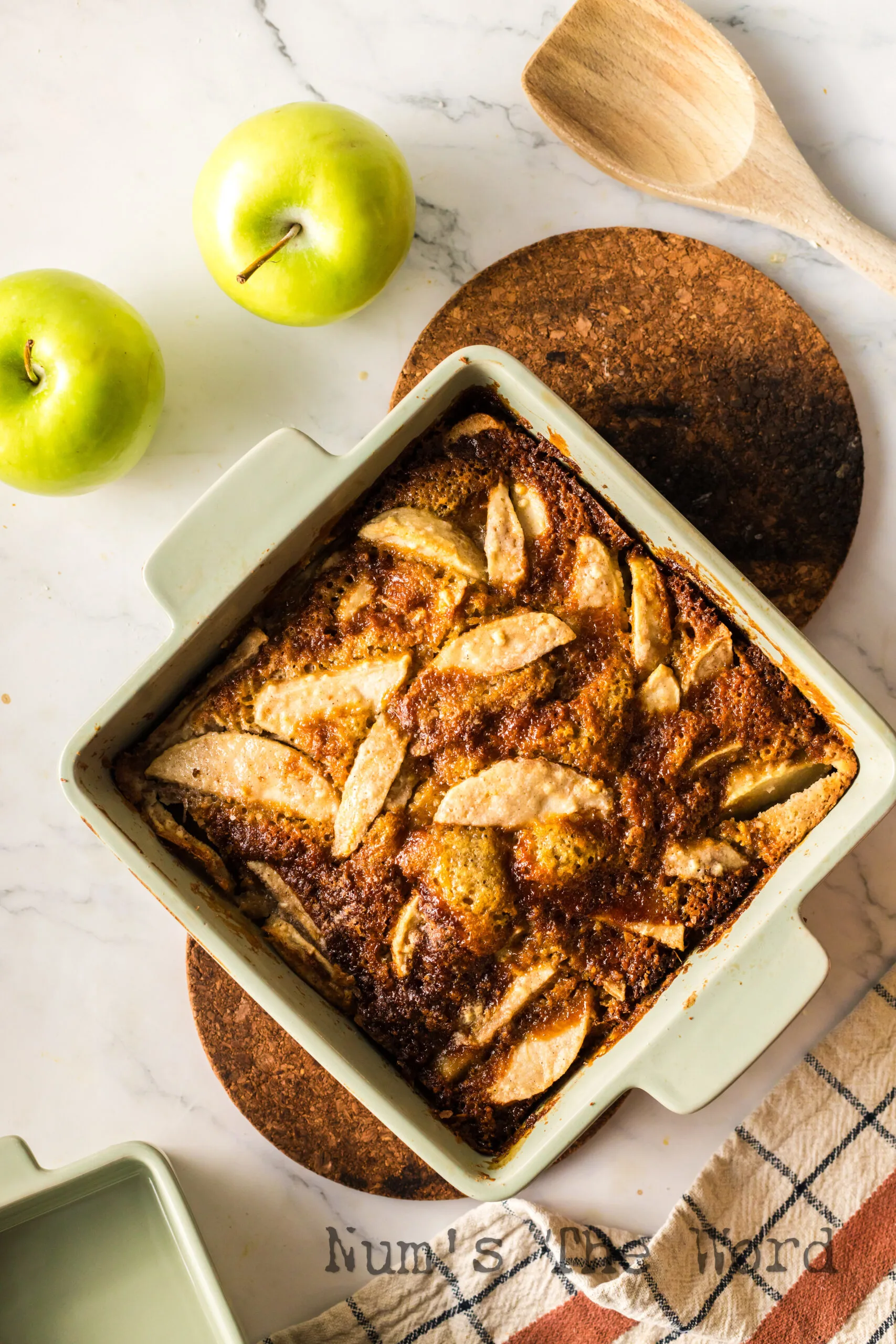 zoomed out image of baked apple cobbler cake in