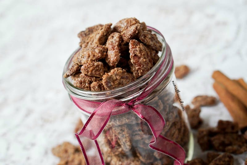 Cinnamon Pecans - side angle view of pecans in a glass jar