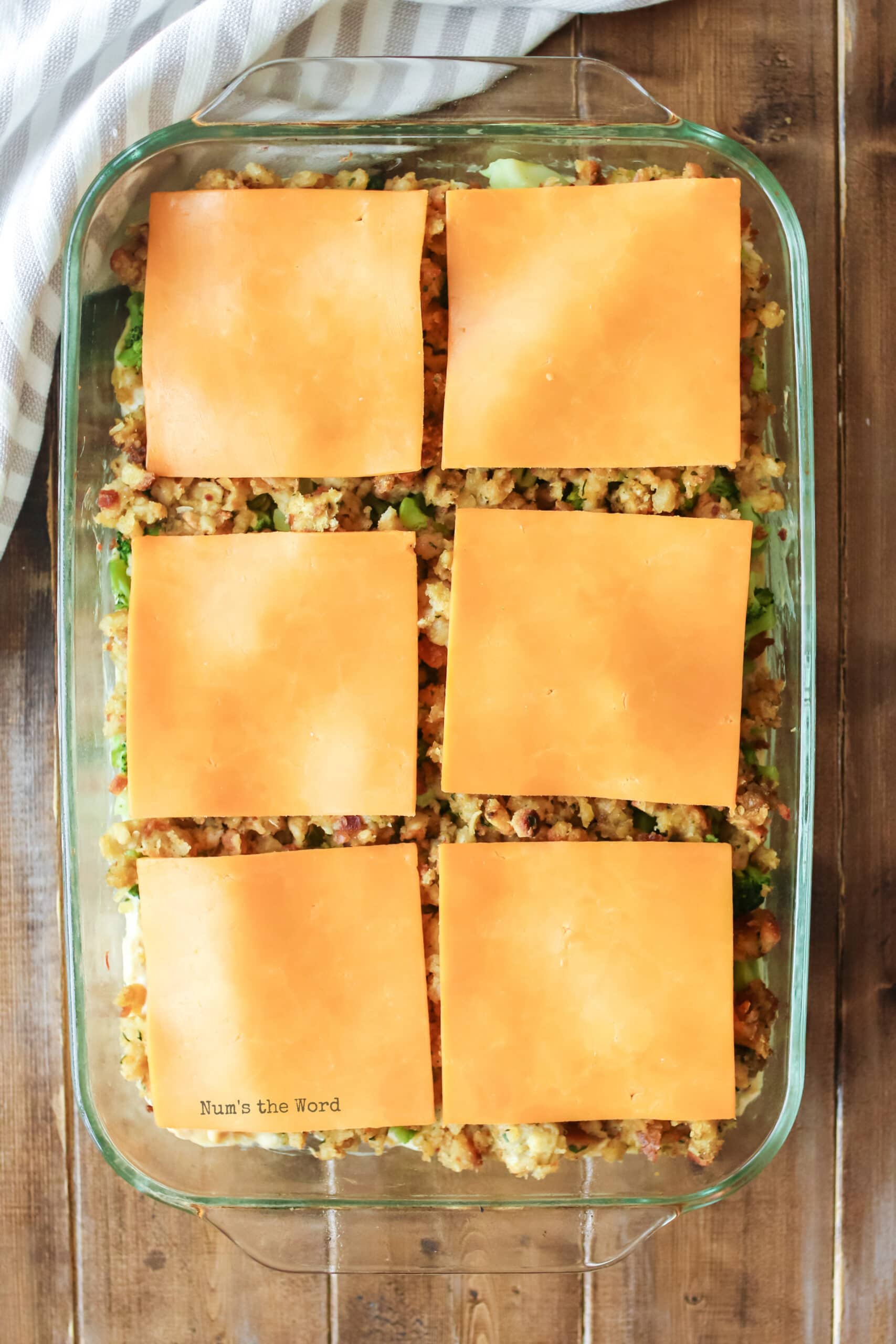 Turkey Casserole - cheese slices placed on top of stuffing in casserole dish.