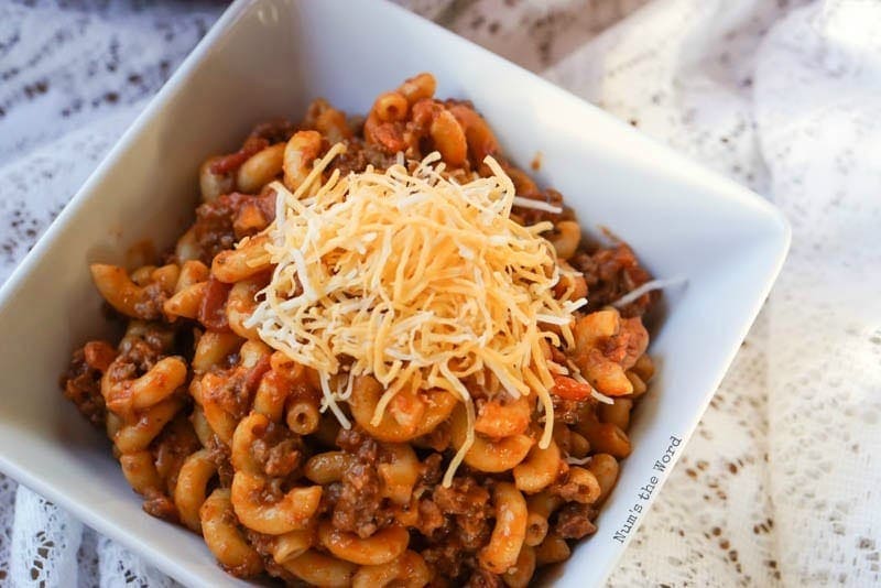 Bacon Cheeseburger Macaroni - Macaroni in a bowl topped with cheese