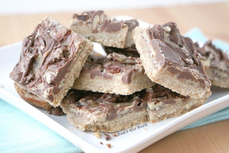 Turtle Shortbread Bars - bars cut up and stacked on a plate