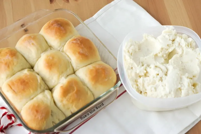 Leftover Mashed Potato Rolls - zoomed out photo taken from above of rolls in pan and bowl of mashed potatoes next to them