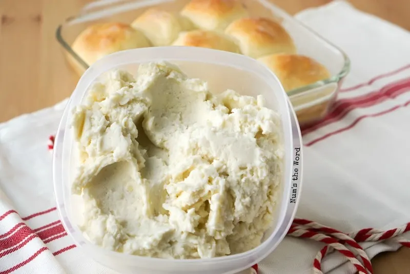 Leftover Mashed Potato Rolls - bowl of mashed potatoes propped up against pan of rolls