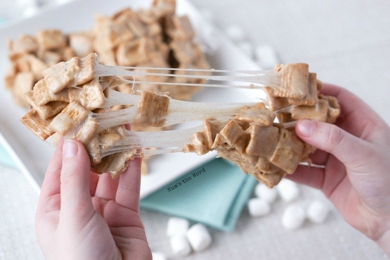 Churro Marshmallow Treats - my daughter holding the treat and pulling it apart. Nice long marshmallow pull.