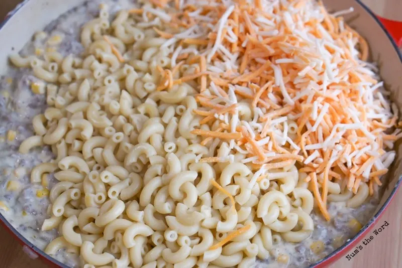 Noodles and cheese added to casserole