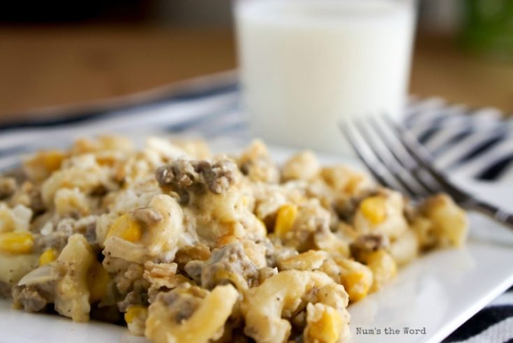 Plated Beefy Noodle Casserole with glass of milk