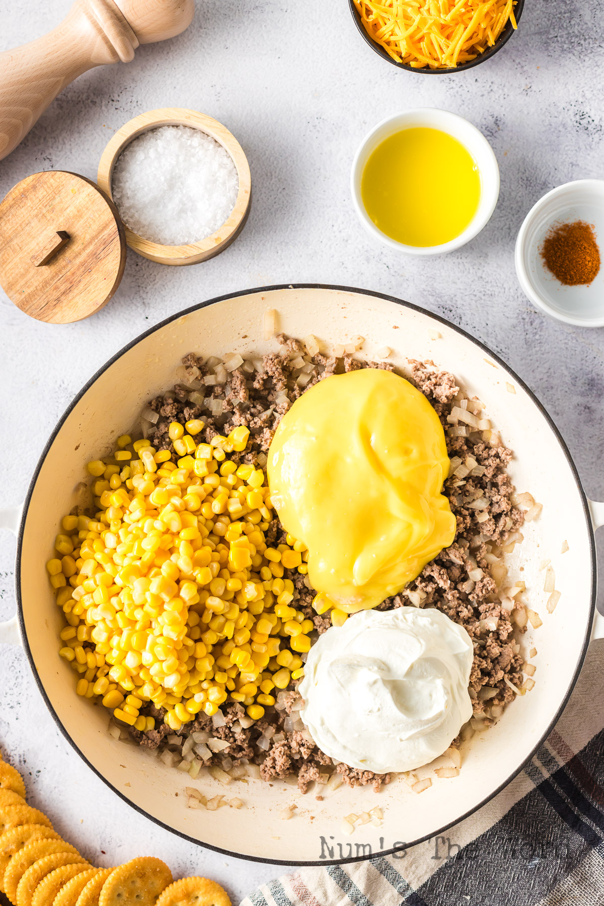 Corn, cream of chicken soup and sour cream added to ground beef mixture