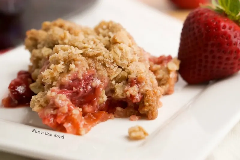 strawberry rhubarb crisp fresh out of the pan onto plate