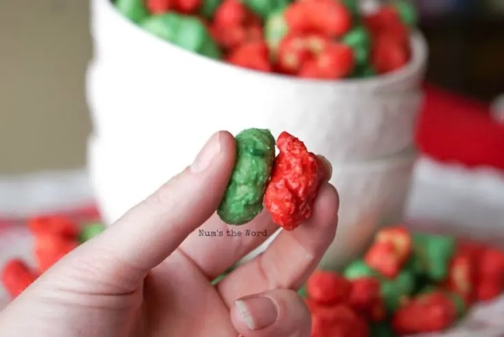 Christmas Puffcorn - Red and green nuggets held in hands side by side