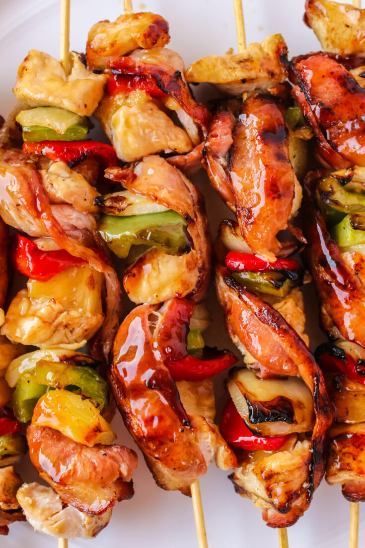 zoomed in image of kabobs cooked and off the grill with glaze on top