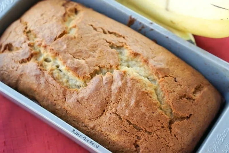 Best Ever Banana Bread - bread in pan at side angle
