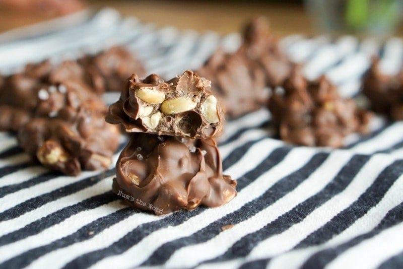 Chocolate Peanut Clusters - on cloth napkin with two stacked on top of each other