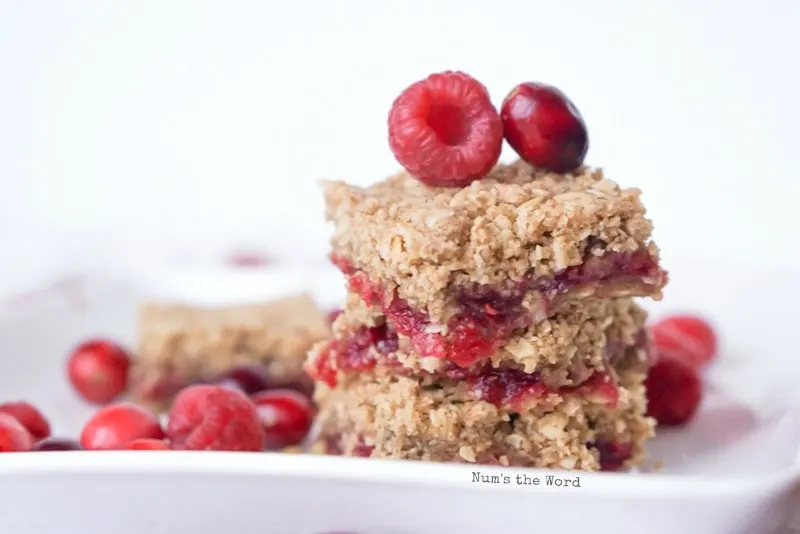 Leftover Cranberry Sauce Bars - straight on view of cranberry bars stacked on top of each other.
