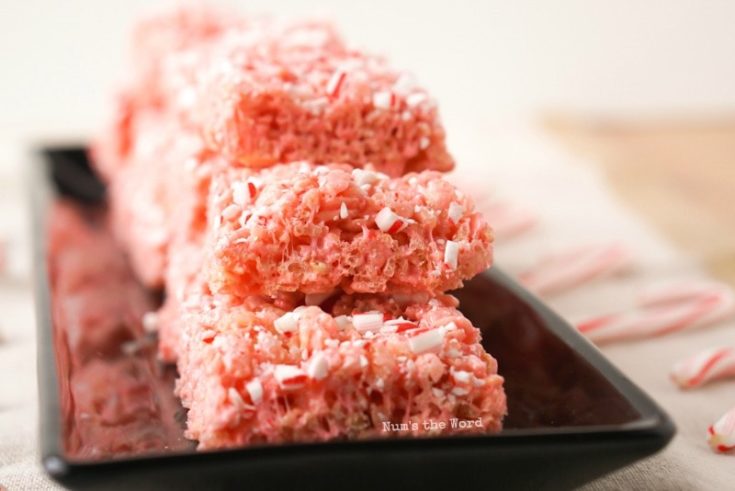 Peppermint Rice Krispy Treats - zoomed in view of stacked up layer of treats on a platter