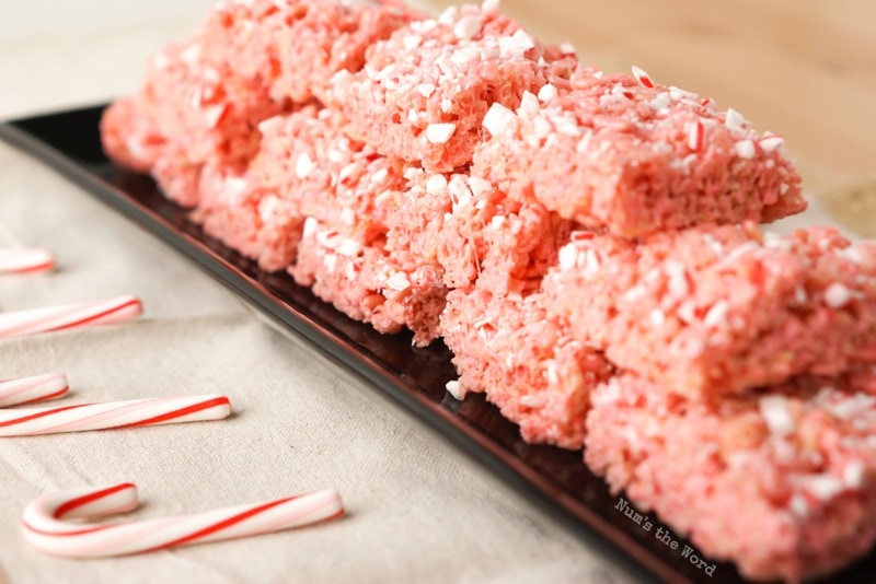 Peppermint Rice Krispy Treats - side angle view of stacked up treats on a platter