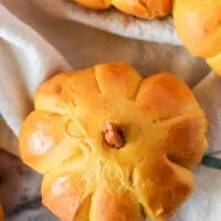 close up of a pumpkin tilted to show the top of the bread roll