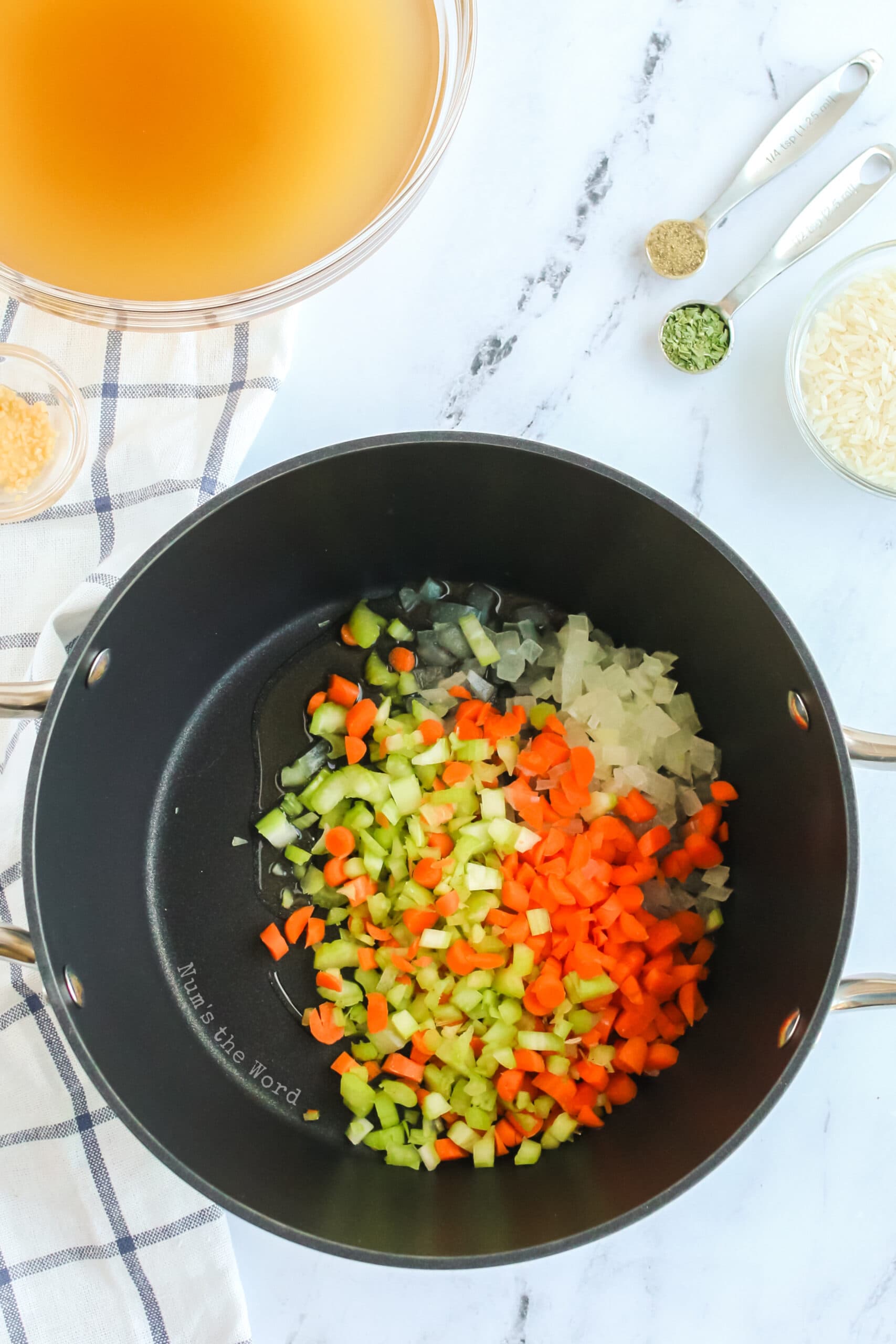 Chicken and Rice Soup - onion carrots and celery in a pot