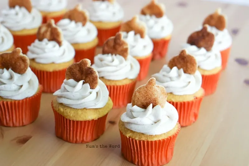 Pumpkin Cupcakes - cupcakes topped with frosting and pie crust cookie in shape of pumpkin