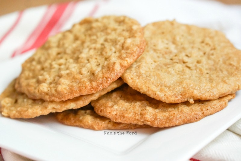 Chewy Oatmeal Lace Cookies - cookies scattered on a plate.