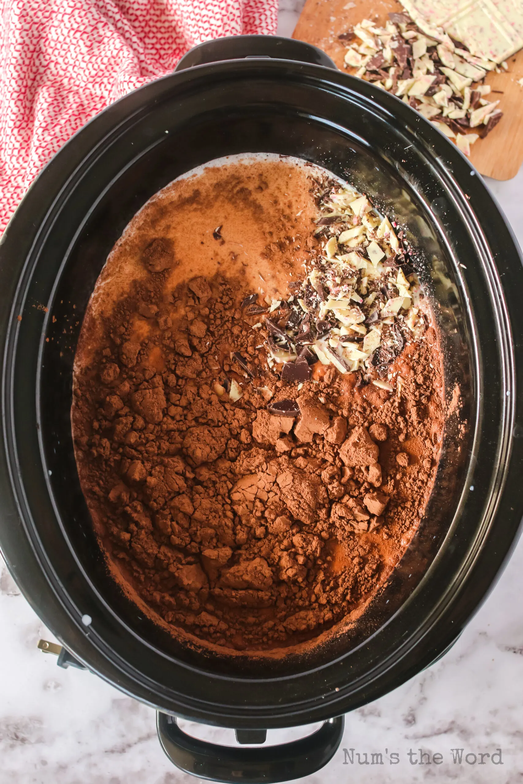 cocoa powder & ghiradelli peppermint bark added to crock pot