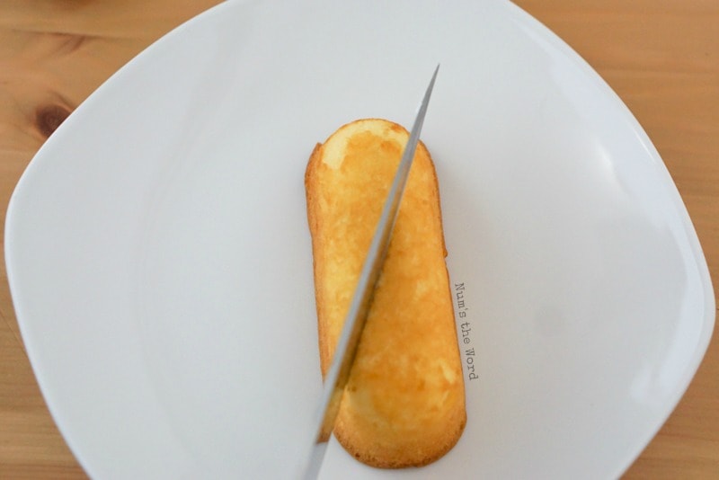 Twinkie Hearts - Showing how to cut second twinkie with knife at angle to the right.