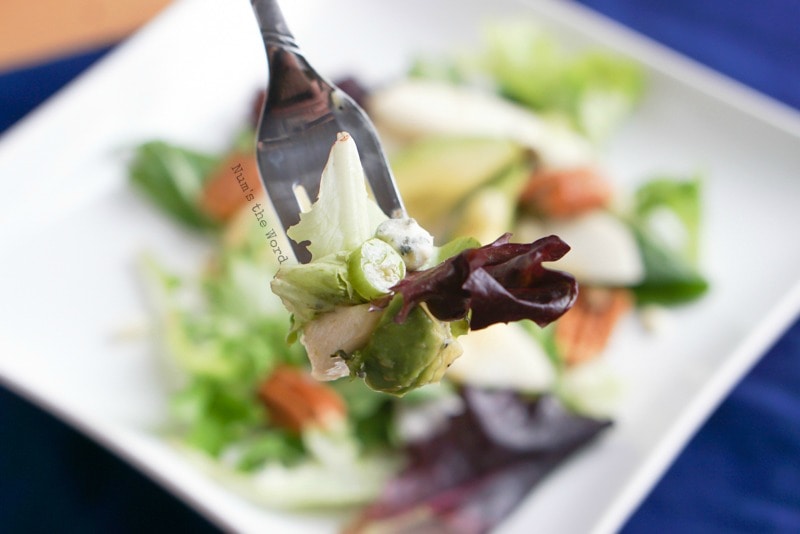 Roquefort Pear Salad - fork full of salad with salad in background