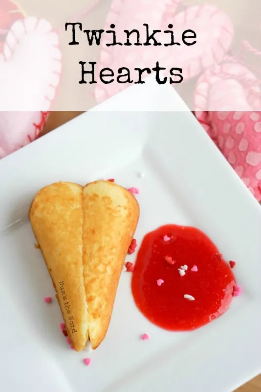 Twinkie Hearts - Main image for recipe of Twinkie cut into a heart with a dollop of Raspberry Puree next to Twinkie and sprinkles all around