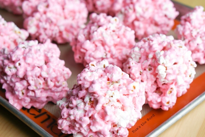 Peeps Popcorn Balls - Popcorn balls formed and on cookie sheet. Photo taken from above side angle