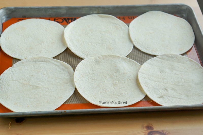 Pulled Pork Flautas - 6 flour tortillas laid out empty.