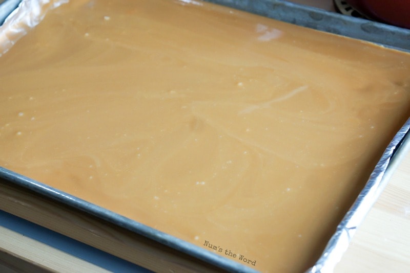 Sea Salt Caramels - Caramel poured into prepared jelly roll pan. Sea salt has not been sprinkled on top yet.