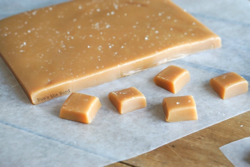 Sea Salt Caramels - Caramel slab in background with sliced caramels in front