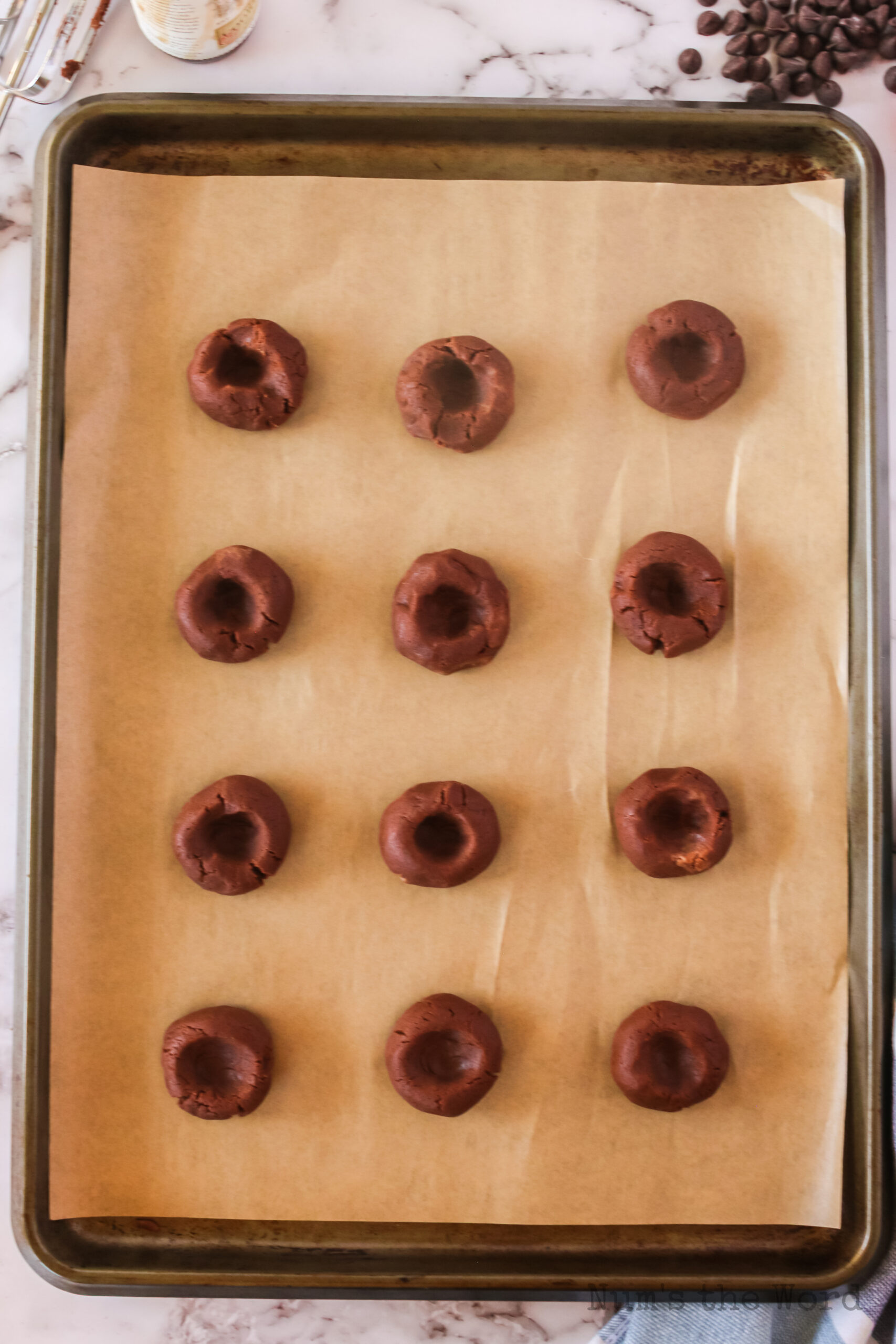 a thumbprint placed into each dough ball