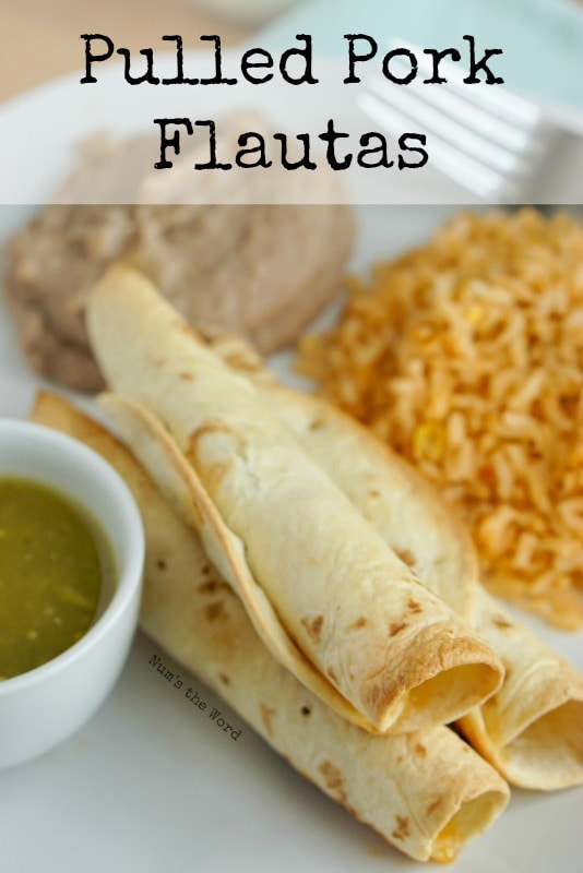 Pulled Pork Flautas - Main image for recipe. Baked flautas on a plate with mexican rice and refried beans