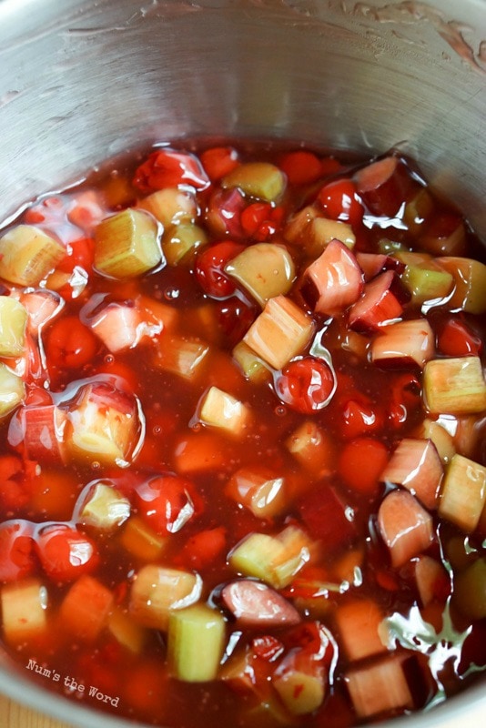 Cherry Rhubarb Crisp - thickened syrup poured over rhubarb and cherries.