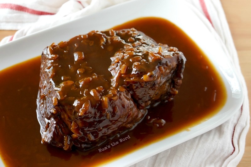 Cranberry Pot Roast - Cooked roast with sauce on platter