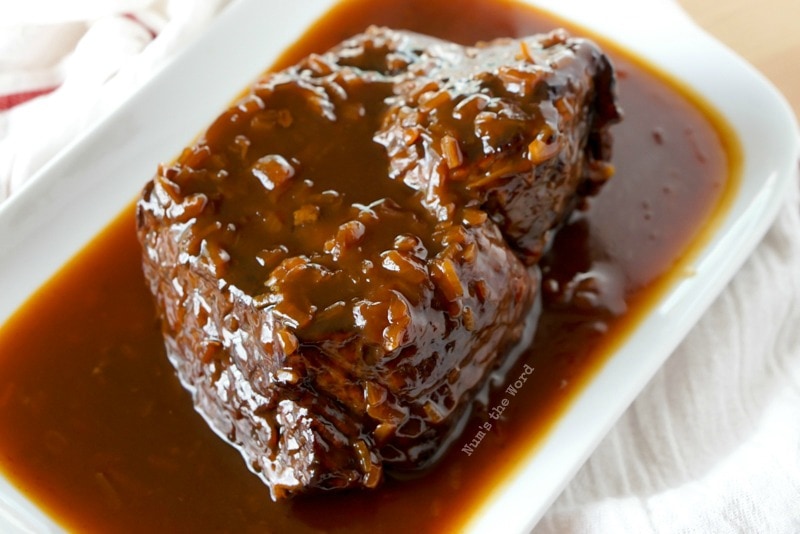 Cranberry Pot Roast - top view of cooked roast with sauce on platter