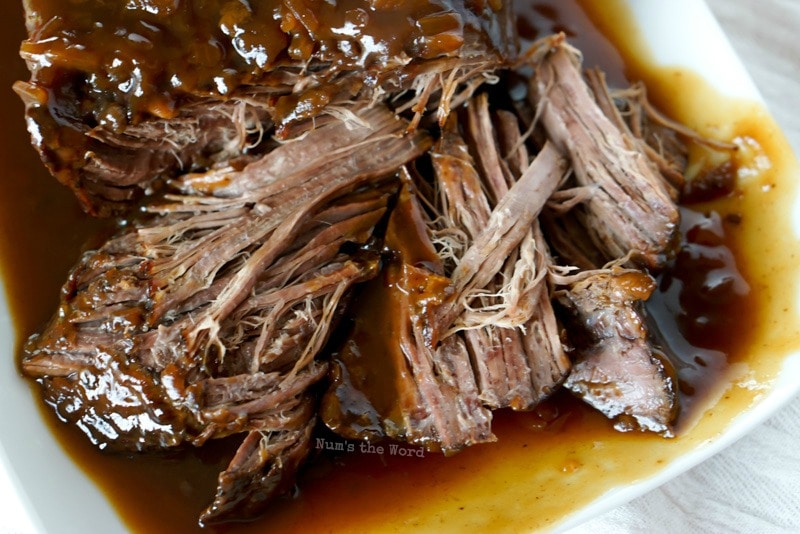 Cranberry Pot Roast - close up of pulled pot roast.