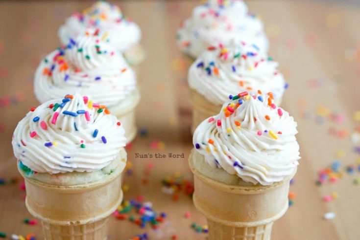 Funfetti Buttercream Frosting - front view of cupcakes on table with yummy frosting and extra sprinkles