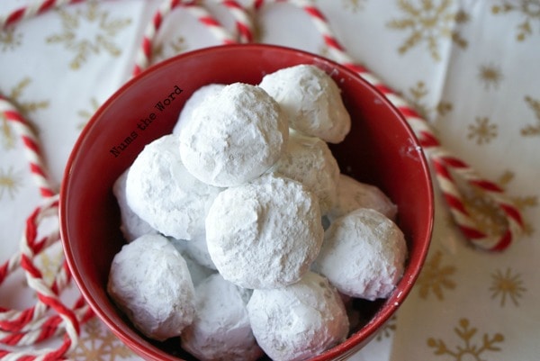 Surprise Snowball Cookies - bowl full of cookies hiding their secret surprise inside.