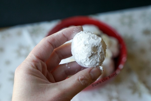 Surprise Snowball Cookies - hand holding an uncut cookie to show size.