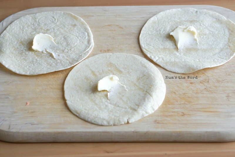 Cinnamon Sugar Tortilla Chips - tortillas with a dollop of butter on each tortilla