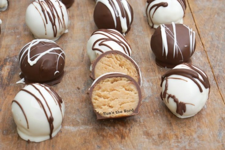 zoomed in image of truffle balls on cookie sheet with one cut in half.