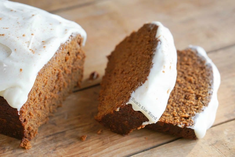 Gingerbread Cake - side view of frosted cake on cutting board