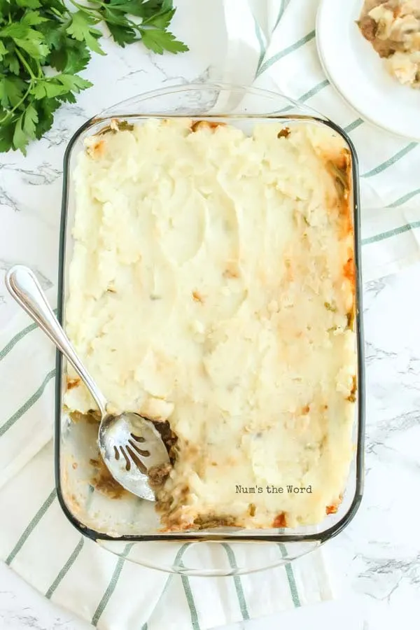 Salisbury Steak Casserole Recipe - a scoop of casserole removed from oven with a scoop removed