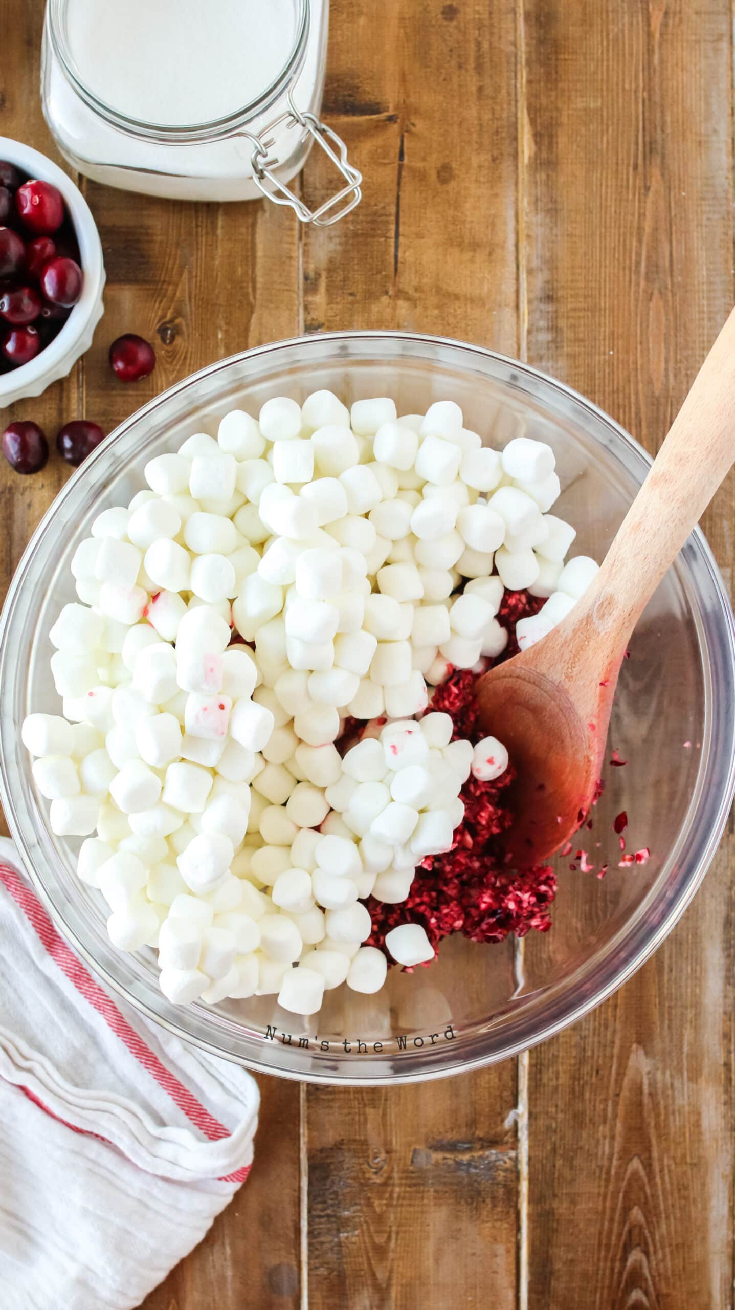 ground up cranberries in a bowl with mini marshmallows added.