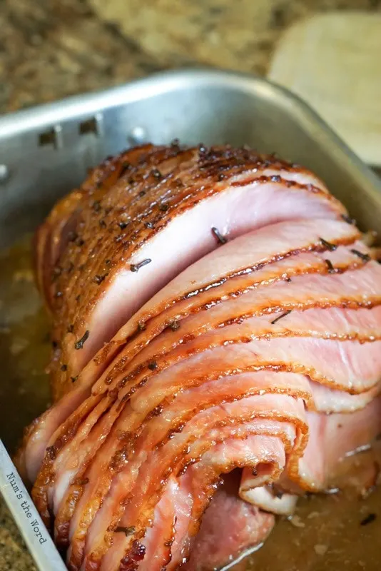 Honey Baked Ham Recipe - finished baked ham in large pan ready to be sliced and eaten!