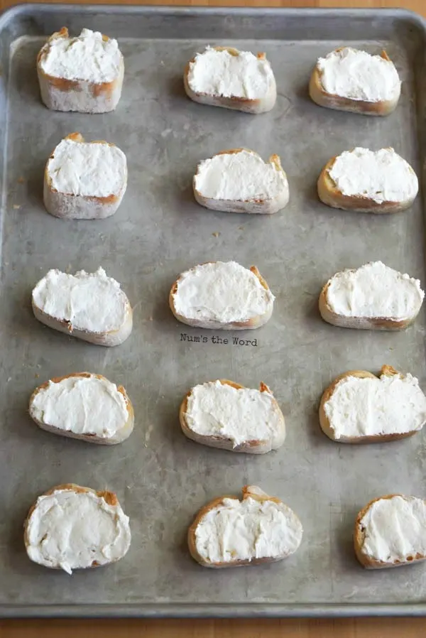 Leftover Cranberry Sauce Bruschetta - cream cheese smeared on top of each bruschetta