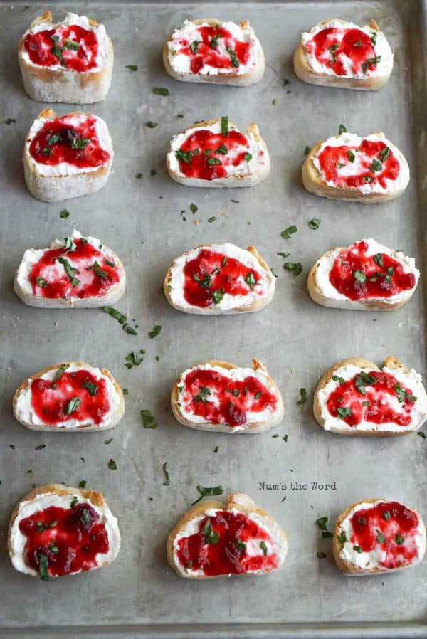 Leftover Cranberry Sauce Bruschetta - diced basil sprinkled on top of each bruschetta